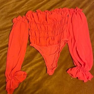 Orange off the shoulder body suit